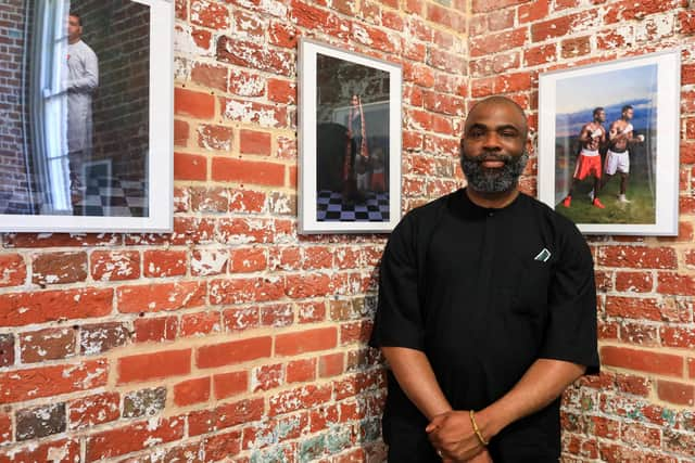 Artist Olufemi Olaiya with some of his work. Now We Are Here exhibition at Aspex Gallery, Gunwharf Quays, Portsmouth. Picture: Chris Moorhouse