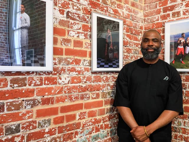 Artist Olufemi Olaiya with some of his work. Now We Are Here exhibition at Aspex Gallery, Gunwharf Quays, Portsmouth. Picture: Chris Moorhouse