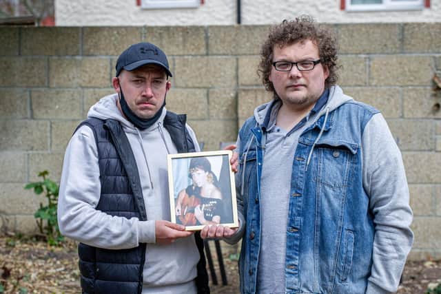 Sonny and Harry Shaw with a picture of their mother, Dee at their home in Cosham. Picture: Habibur Rahman