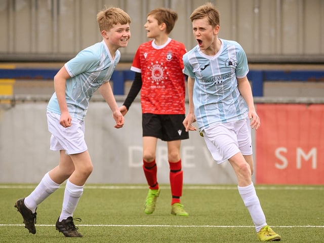 Action from the Portsmouth Youth League Geldard Invitation Cup final between Jubilee 77 U13s and Castle United U13s (light blue and white kit). Picture: Keith Woodland (190321-403)