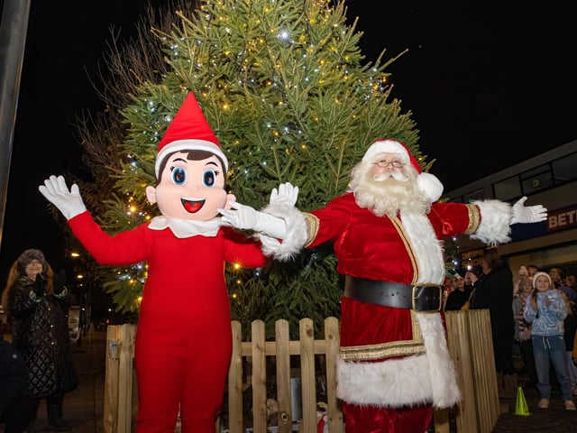 Santa Clause and The Elf celebrate the light switch on in Waterlooville.  Photos by Alex Shute