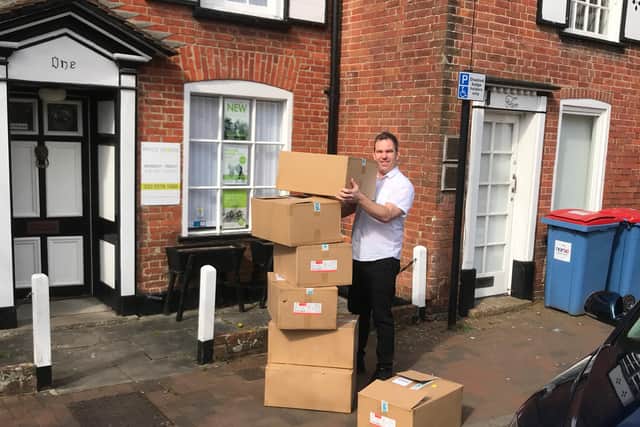 A driver for Andicars loads his vehicle with Mr Moughadam's donated protective equipment before taking it to Queen Alexandra Hospital on April 2.