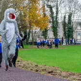 Sharps Copse Primary School is officially opening their Sharpy Shark Run track in their school field on 27 November 2020. 
The track was put in through funding support from Hampshire County Council (£36,000) via the sugar tax and put in by the company Scandor.

Pictured:  Head Teacher, Mike Elsen leading their first run with the children on the track on 27 November 2020.

Picture: Habibur Rahman