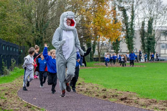 Sharps Copse Primary School is officially opening their Sharpy Shark Run track in their school field on 27 November 2020. The track was put in through funding support from Hampshire County Council (£36,000) via the sugar tax and put in by the company Scandor.Pictured:  Head Teacher, Mike Elsen leading their first run with the children on the track on 27 November 2020.Picture: Habibur Rahman