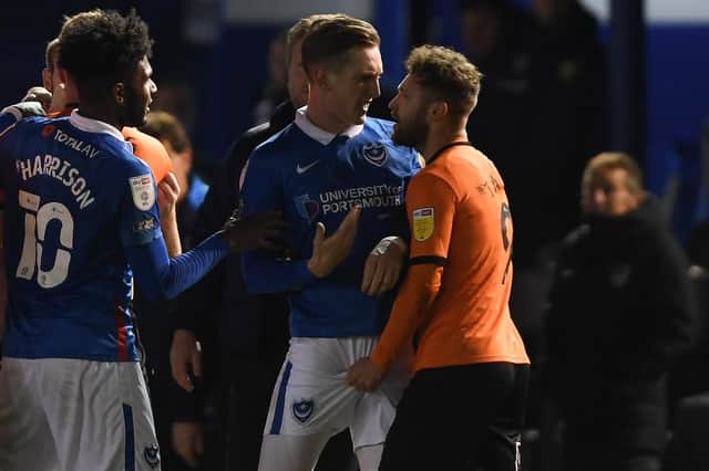 Matty Taylor is seen grabbing Ronan Curtis' genitals following Pompey's 1-1 draw with Oxford United. (Picture: Mike Hewitt/Getty Images)