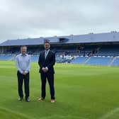 Andrew Cullen, Chief Executive of Portsmouth FC with Stephen Morgan MP on the pitch at Fratton Park