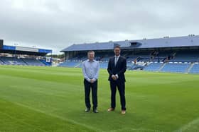 Andrew Cullen, Chief Executive of Portsmouth FC with Stephen Morgan MP on the pitch at Fratton Park