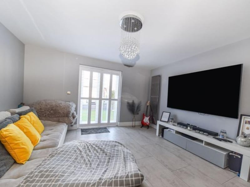 The listing says: "This property benefits from double glazing, gas central heating system, driveway parking, mature landscaped rear gardens, modern open plan living and kitchen area, cloakroom/W.C, family bathroom, bedroom one with en-suite, and viewing is a real must."