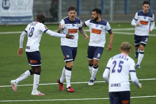 Sam Magri, second left, celebrates his equaliser against Oxford City. Picture: Dave Haines.