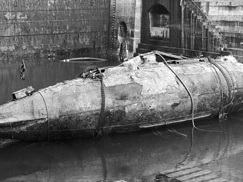 The Royal Navy's first submarine, the Holland I, in a basin at Devonport dockyard after being salvaged, 8th December 1982. The Holland I sank while on tow to the breaker's yard and lay on the sea bed near the Eddystone lighthouse for sixty-nine years. The vessel is due to be restored and displayed at the Royal Navy Submarine Museum at Gosport. (Photo by Keystone/Hulton Archive/Getty Images)
