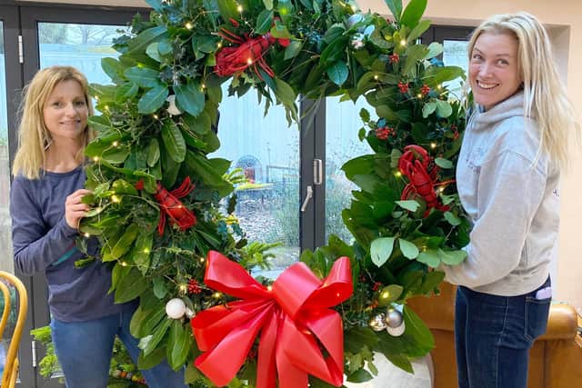 Julie Marjoram and Anna Tonkin from Blooms & Wishes with their lobster wreath