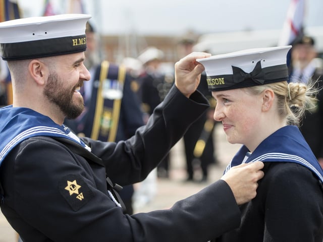 HMS Nelson Writers Abbie Smith and Tom Woodhouse, prepare for the Falkands march in Old Portsmouth.