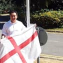 Havant MP Alan Mak prepares to hoist the flag of St. George