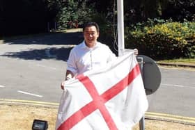 Havant MP Alan Mak prepares to hoist the flag of St. George