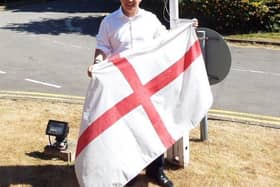 Havant MP Alan Mak prepares to hoist the flag of St. George