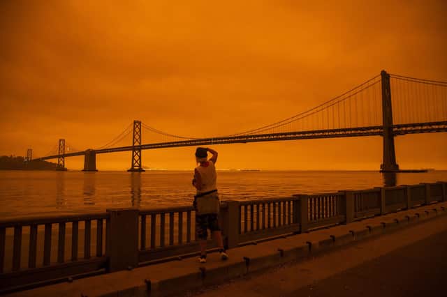 The wildfires' orange glow shrouds the Golden Gate Bridge in San Francisco. Picture: Philip Pacheco/Getty Images