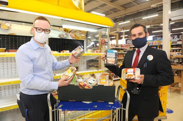 Tesco has teamed up with food waste app Olio and is preventing food from going to waste.
Pictured is: (l-r) Matt Rice-Smith, lead trade manager, and Grzegorz Zdybel, fresh food manager at Tesco in Fareham.
Picture: Sarah Standing (161020-6017)
