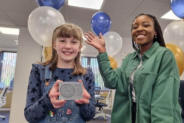 Bethany Turner and her design engraved, with Blue Peter presenter Mwaksy Mudenda at In-Space Missions in Alton, Hampshire.