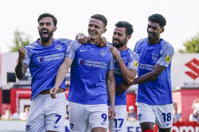 Pompey celebrate Colby Bishop's second goal in the 2-0 win at Cheltenham Picture: Jason Brown