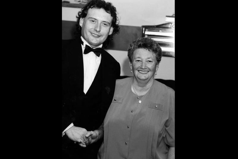 Jimmy White meets Mavis Lewis at The Top Spot Snooker Club in Leigh Park to make up for her disappointment of travelling from Wales to see him in Southsea earlier this year when the show was cancelled, 1993. The News PP4530