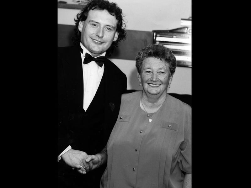 Jimmy White meets Mavis Lewis at The Top Spot Snooker Club in Leigh Park to make up for her disappointment of travelling from Wales to see him in Southsea earlier this year when the show was cancelled, 1993. The News PP4530