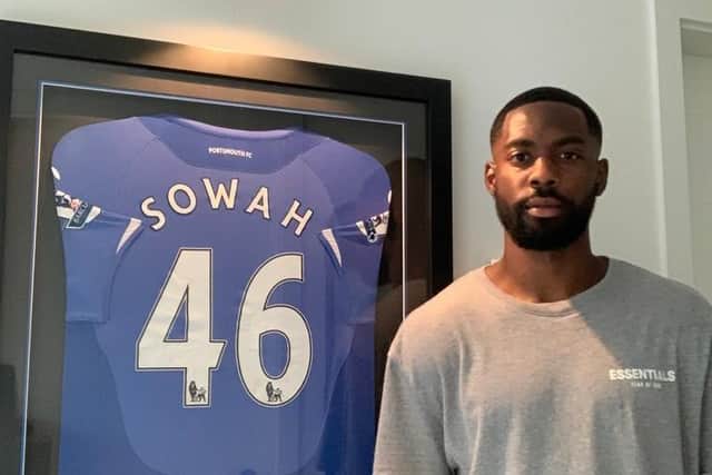 Lenny Sowah, now aged 27, beside the Pompey shirt he wore to create his Premier League record