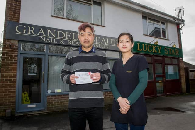 11/3/20Staff of Grandeur Beauty Nail Salon and Luck Star Takeaway recieved a racist letter following the Coronavirus outbreak.Pictured: Phil Tu and Ivy Ho outside their shops with the racist letter.Picture: Habibur Rahman