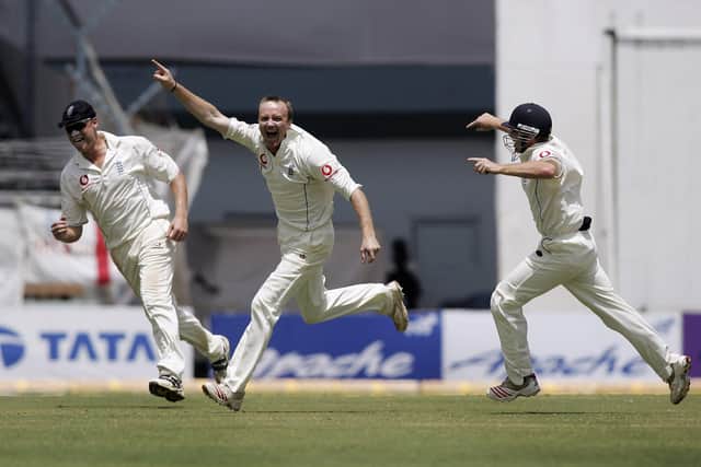 Shaun Udal celebrates with Andrew Flintoff and Ian Bell after taking the key wicket of Sachin Tendulkar at the Wankhede Stadium, Mumbai, in March 2006. Photo by Ben Radford/Getty Images.