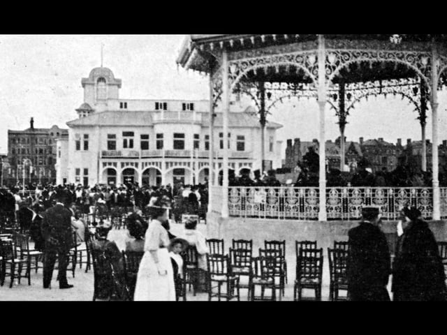 Looking towards South Parade, from the end of South Parade Pier, with a band in full flow on the bandstand.