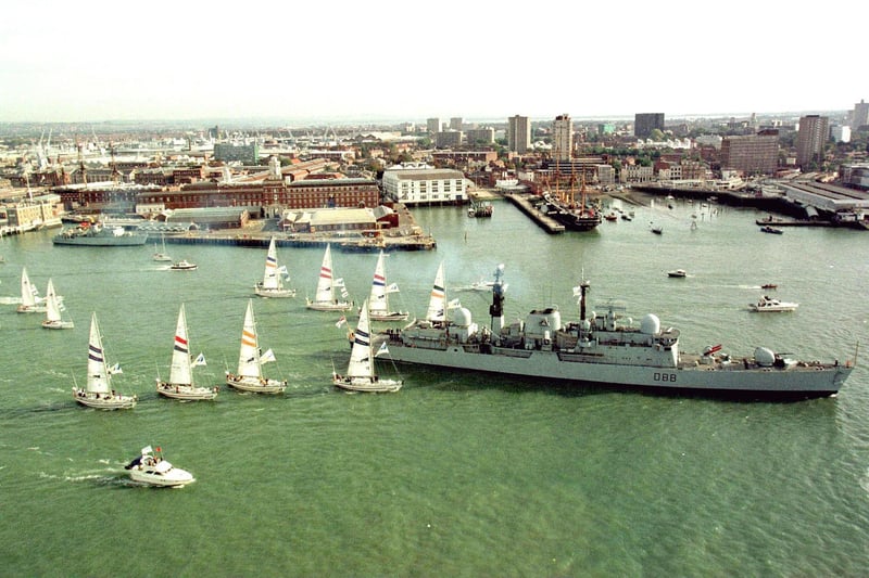 HMS Glasgow leading the Times Clipper 2000 Round The World Yacht fleet through the spectator fleet on the way to Portsmouth Harbour entrance on Sunday October 15 2000, for the start of the race. PA Photo: Peter Bentley/HANDOUT