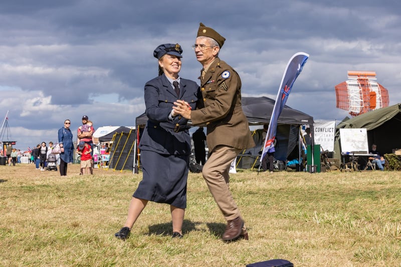 Impromptu jive dancing to a 40s soundtrack. Pictured: Jacquie Broom (56) and Robert Tipping (53).