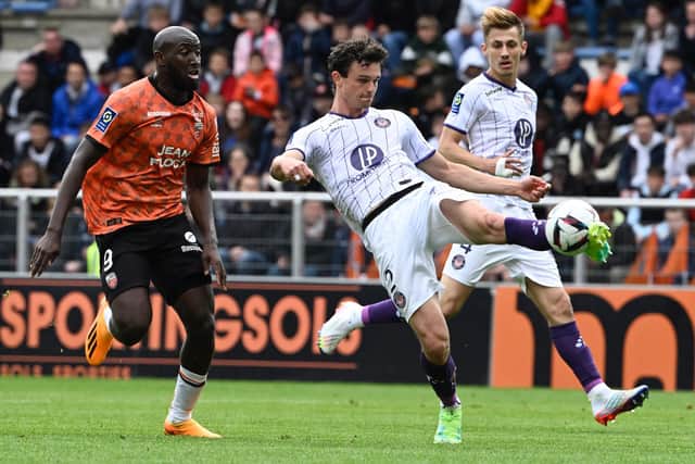 Rasmus Nicolaisen, now with Toulouse, clears from Lorient's Ibrahima Kone in Ligue 1 last month. Picture: DAMIEN MEYER/AFP via Getty Images