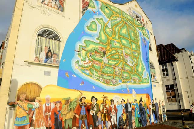 Artist Mark Lewis has been adding more to his ever growing mural on the junction of Waverley Road and Clarendon Road in Southsea.Picture: Sarah Standing (171120-8709)