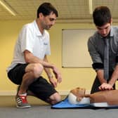 Defence correspondent Tom Cotterill pictured during a first aid event at the Littlehampton Swimming and Sports Centre with coach Mike Mole in 2013.