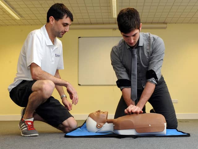 Defence correspondent Tom Cotterill pictured during a first aid event at the Littlehampton Swimming and Sports Centre with coach Mike Mole in 2013.