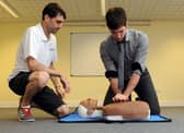 Defence correspondent Tom Cotterill pictured during a first aid event at the Littlehampton Swimming and Sports Centre with coach Mike Mole in 2013.