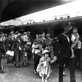 Portsmouth policeman with evacuees. The News PP292