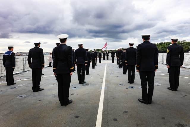 Some of the ship's company of HMS Tamar gather on the ship's flight  deck during the vessel's commissioning ceremony. Photo: LPhot Alex Ceolin