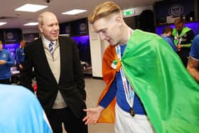 Ronan Curtis, donning the Irish tricolour, speaks to owner Michael Eisner after Pompey's Checkatrade Trophy triumph. Picture: Joe Pepler