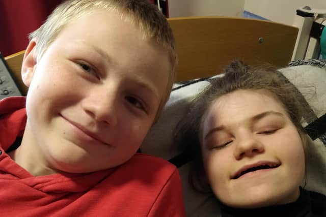 Eleanor Raleigh, 15, with her brother Lewis, 11, at home in Fareham

Teenager Eleanor Raleigh, 15, has quadriplegic cerebral palsy and epilepsy due to a rare genetic condition, Incontinentia Pigmenti, and was blind until around two years ago when she inexplicably regained her sight to the astonishment of her family. This has led to her 11-year-old brother Lewis taking on a 24-hour silence fundraiser to make the £12,000 needed for equipment so his sister can communicate with them in a way that matches her cognitive ability.


