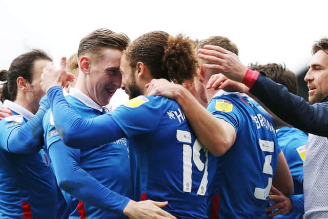 Ronan Curtis, left, congratulates team-mate Marcus Harness following his match-winner against Ipswich.  Picture: Joe Pepler