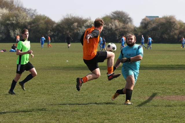 Action from the City of Portsmouth Sunday League Division Five match between AFC Farlington (orange shirts) and AFC Bedhampton Village A (light green shirts). Picture: Sam Stephenson