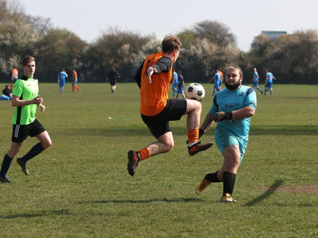 Action from the City of Portsmouth Sunday League Division Five match between AFC Farlington (orange shirts) and AFC Bedhampton Village A (light green shirts). Picture: Sam Stephenson