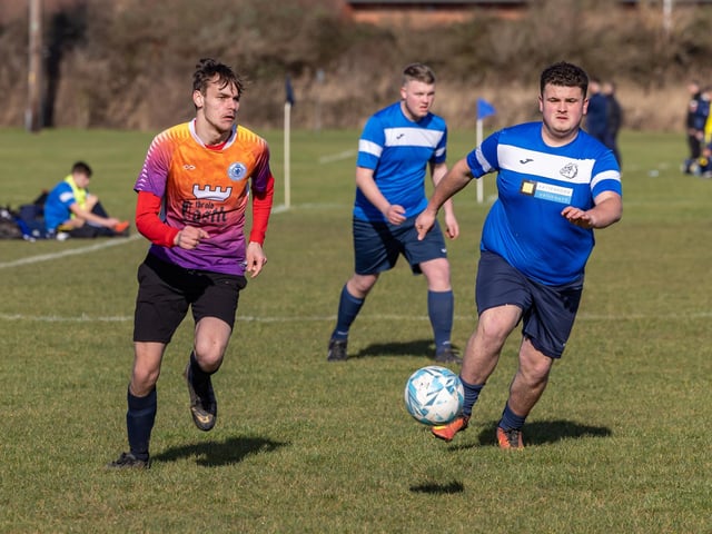 Bulldog (blue) v King George Rovers. Picture: Mike Cooter