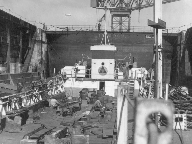 Landing Craft, Tank (LCT) 979 undergoing repairs in dry dock in Portsmouth Dockyard after D-Day. Many landing craft were damaged on D-Day or in subsequent landings and many were repaired in the dockyard. Photo by Lieutenant Phillips William Doleman Winkley of LCT 979.