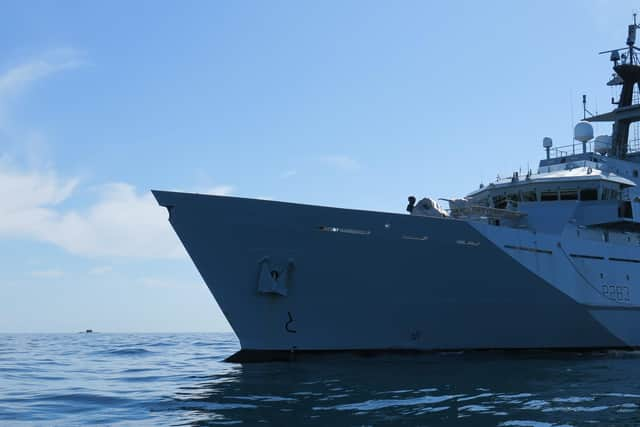 Russian Kilo-class submarine Krasnodar pictured in the background with HMS Mersey, front and centre. Photo: Royal Navy