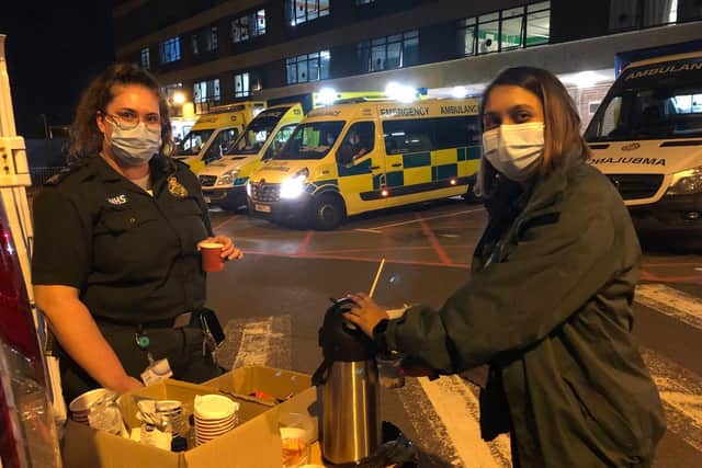 A SCAS crew member (right) and volunteer Nikhyta Patel (left). Picture: SCAS