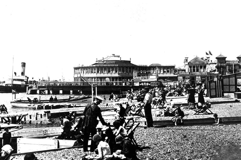 Deckchair man at Clarence pier c 1930. A deckchair attendant collects money while a steamer collects passengers for a leisurely Solent trip from the old pier.