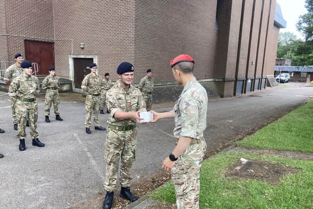 Cadet Jack Baldwin receiving top shot on competition day from Captain Nayagam