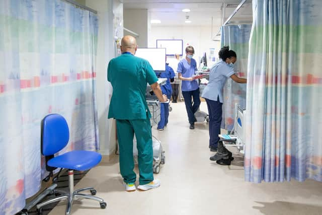 Hospital staff inside QA pictured working on a busy ward 

Picture Habibur Rahman